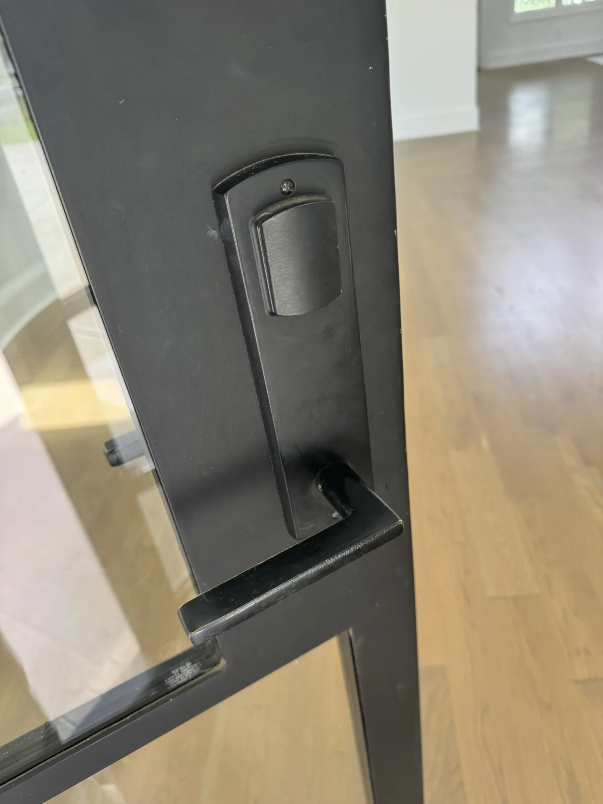 Matte black deadbolt and lever on a home entry door serviced on-site in Mooresville, NC