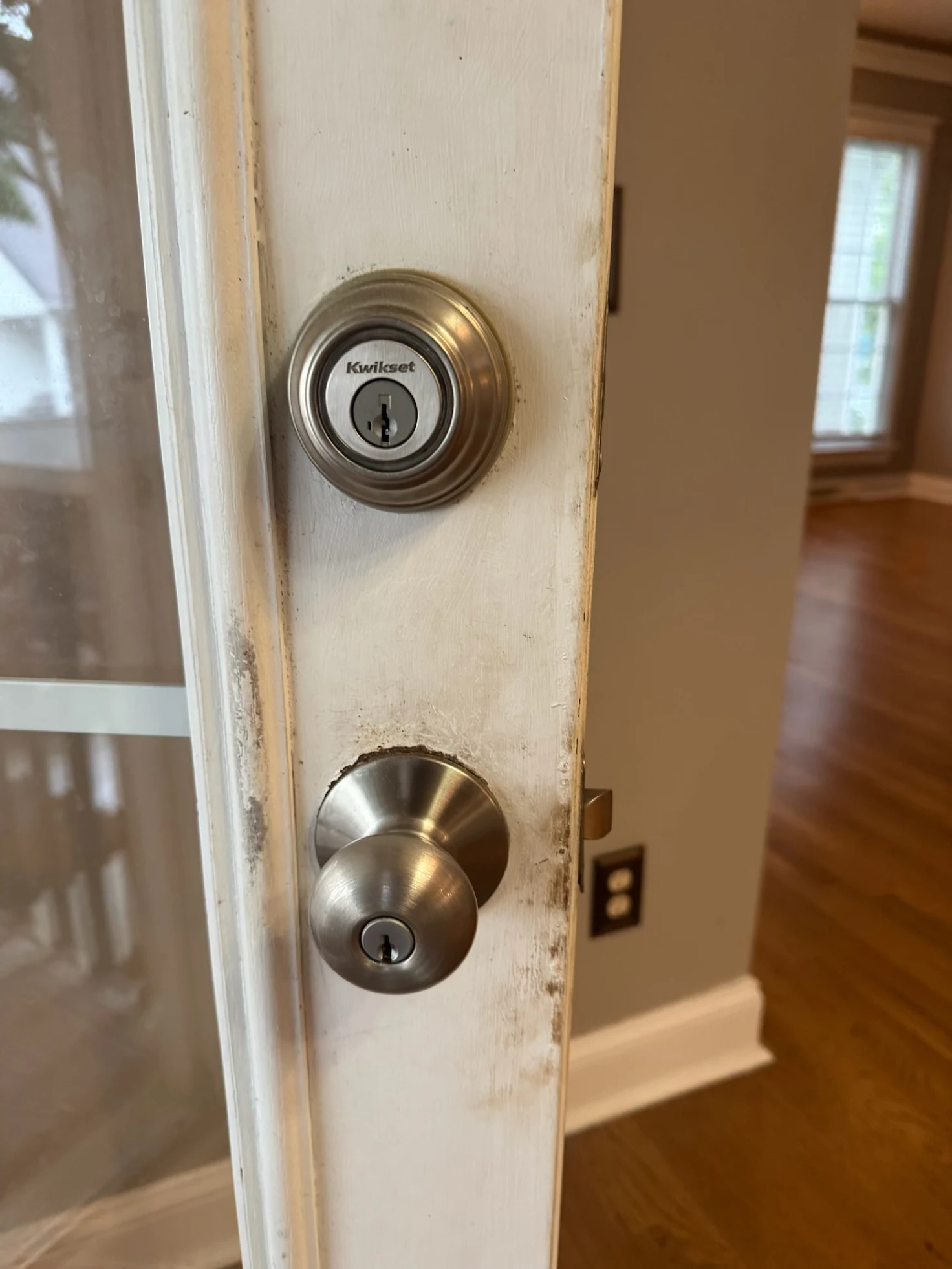 Professional installation of a new residential brass deadbolt and door knob set. Expert home locksmith services for lock replacement and fresh installation in Charlotte and Huntersville, NC.